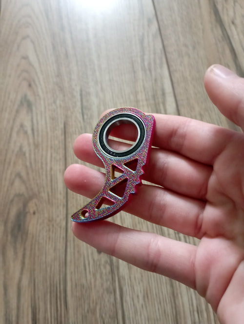 Antystresowy brelok keyrambit w kolorze carnival.